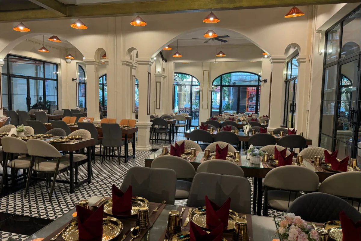 Set dining tables inside the arched Benaras Heritage restaurant at 16–18 Võ Thị Sáu