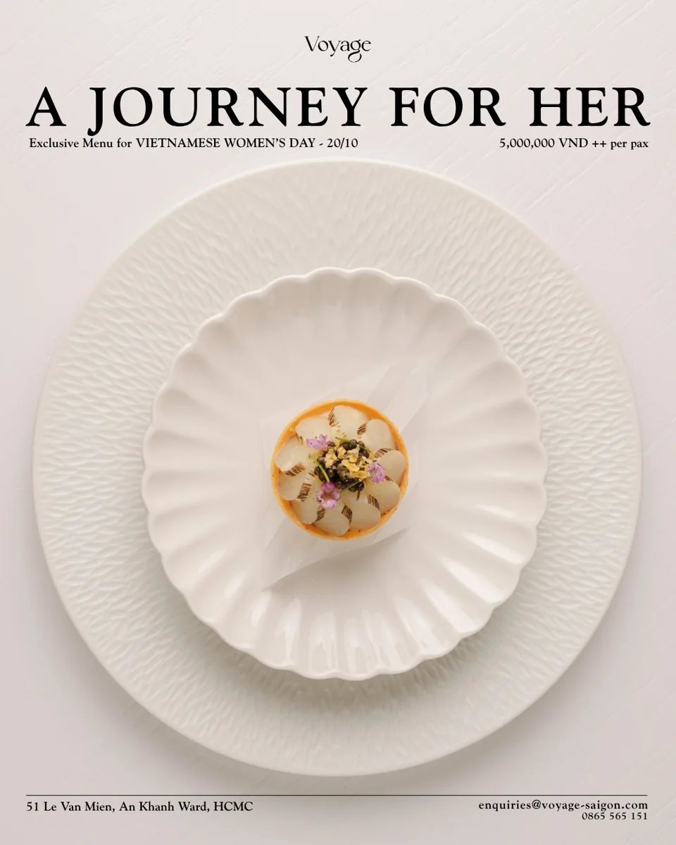 Voyage promotional poster for A Journey for Her exclusive dinner menu on Vietnamese Women's Day 20 October, showing an elegant fine-dining dish on white plates, price 5,000,000 VND++ per pax