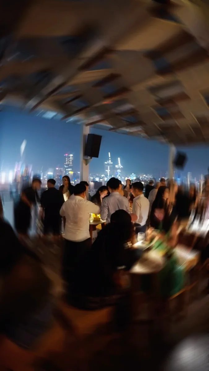 Rooftop crowd at Social Club Rooftop Bar above Saigon