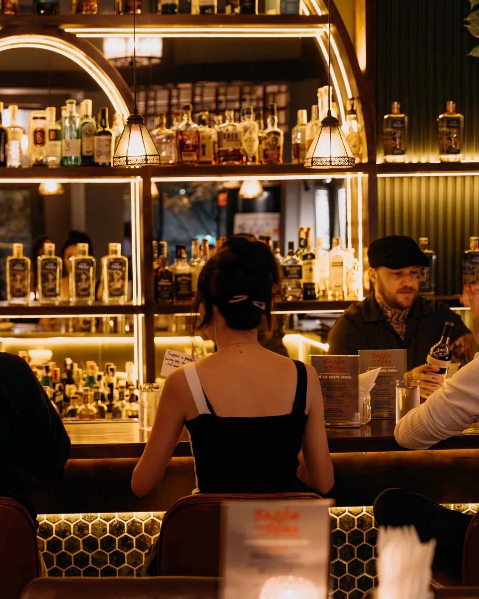 Warmly lit cocktail bar at Alibi, 93C Vo Van Tan