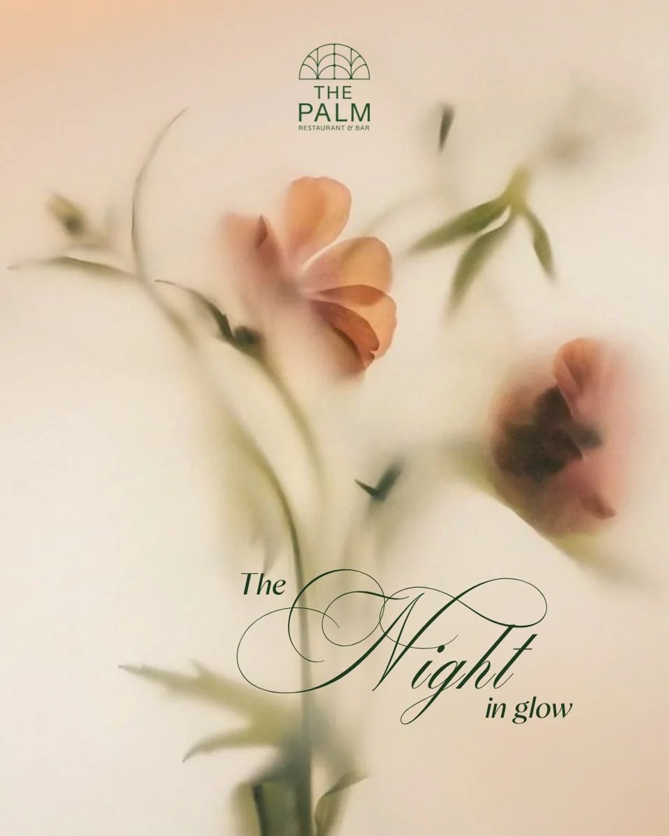 The Palm Restaurant and Bar promotional poster for Vietnamese Women's Day dinner showing The Night in Glow branding with floral imagery
