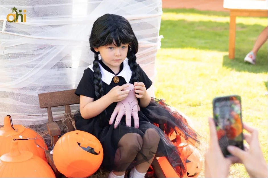 Child in a Halloween costume at an earlier Anne Hill Halloween Bazaar; illustrative photo for the 2026 event across three campuses.