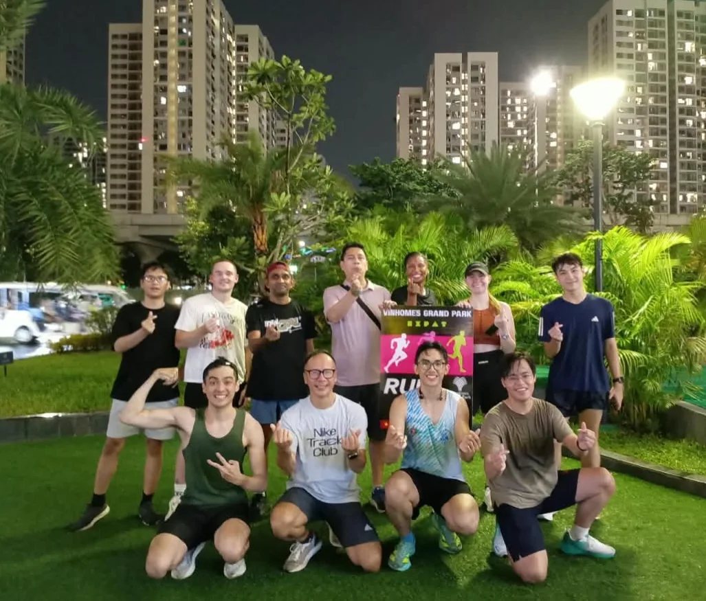 Group of runners posing at Grand Park, Vinhomes Grand Park at night after a Thursday run; shared photo covering both Oct 23 and Oct 30 runs