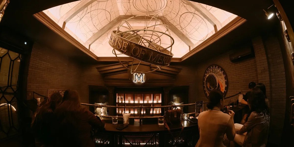 Panoramic interior of House of Merlin at 178/1 Pasteur, with its illuminated ceiling and steampunk bar.