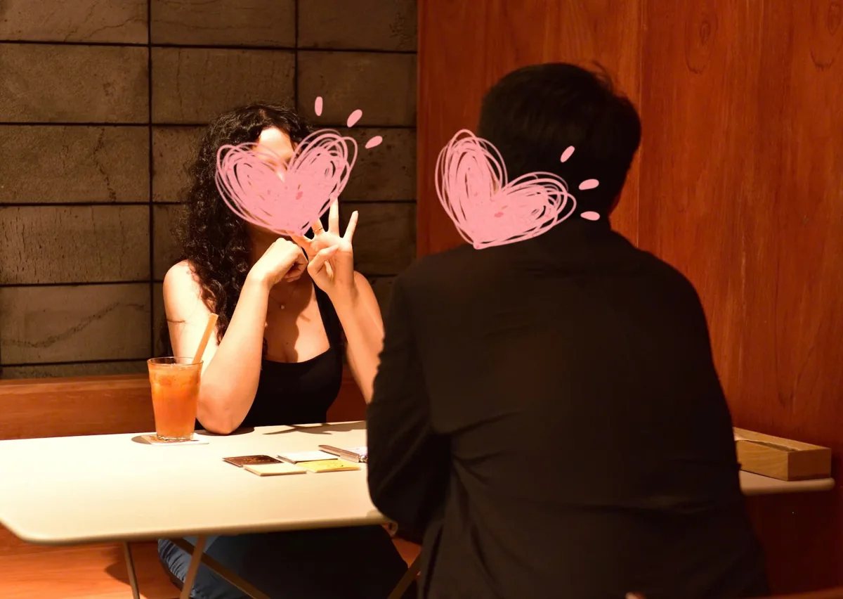 Organizer photo of one-on-one conversations at a singles party
