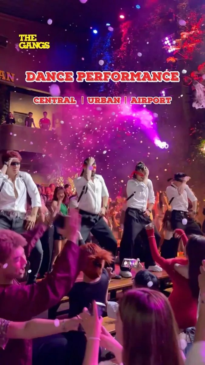 Dance performance at The Gangs with crowd and confetti — text overlay: Dance Performance, Central | Urban | Airport — Vietnamese Women's Day ladies night 20/10 promotion (image shared across all three The Gangs branches)