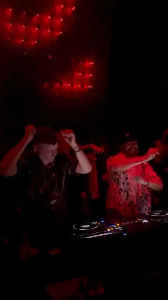 DJs performing under red lighting in Wiznick’s HYLOWEEN announcement reel